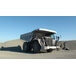 Dump truck with water-based dust suppression